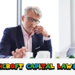 Businessman analyzing Ashcroft Capital lawsuit documents and investment reports at office desk