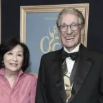 Phyllis Minkoff and Maury Povich at formal event, both smiling in elegant attire at award ceremony