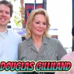 Connor Douglas Gilliland stands with mother actress Jean Smart and sibling at public event in rare family photo showing the private celebrity son