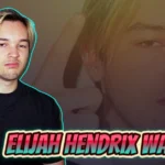 Elijah Hendrix Wahlberg posing in black shirt with blonde hair and hand gesture, son of Donnie Wahlberg and rising musician