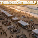 Art thunderonthegulf craft festival aerial view showing white vendor tents, crowds browsing handmade artwork on Gulf Shores beach at sunset with powerboats racing