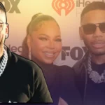 Nelly at iHeartRadio awards wearing crystal chain and glasses, celebrating his $70 million net worth success story