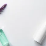 Personal lubricant bottles with lavender and lime on white background for sexual wellness and comfort