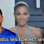 Russell Wilson smiling in a Giants jersey, with Ciara and another portrait of Wilson in the background. Text overlay: Russell Wilson Net Worth.