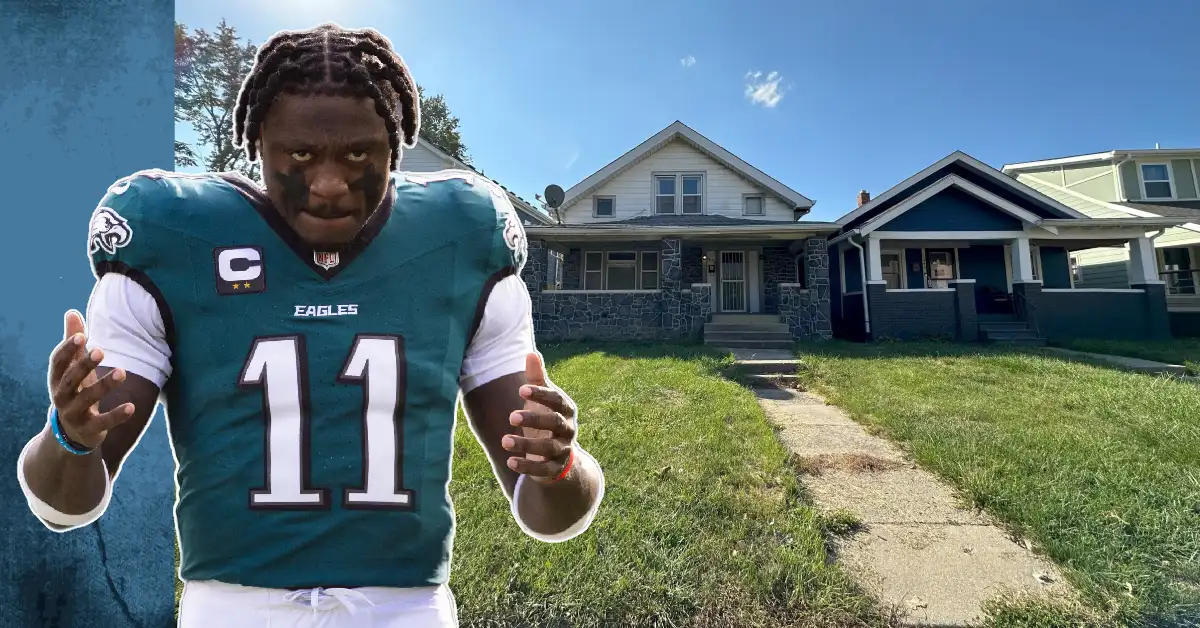 AJ Brown in Eagles jersey number 11 next to his South Jersey house exterior showing Haddonfield property front yard