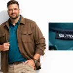 Man wearing extended-size XXXXXXXXL size CXX clothing: brown shacket over teal performance polo with khaki chinos, showing structured fit and 8XL/CXX label detail