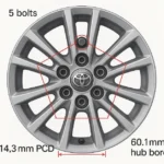 Toyota Camry bolt pattern diagram showing 5x114.3mm PCD measurement with 5 bolt holes and 60.1mm hub bore on silver alloy wheel