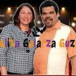 Angelita Galarza Guzman and Luis Guzman on red carpet at Hollywood event with golden barriers and bokeh lighting
