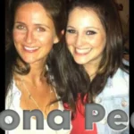 Fiona Peet smiling warmly alongside a young woman in a casual, friendly photo