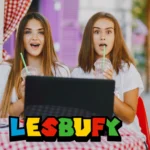 Two women exploring lesbufy platform on laptop - sapphic digital community and storytelling space for queer women