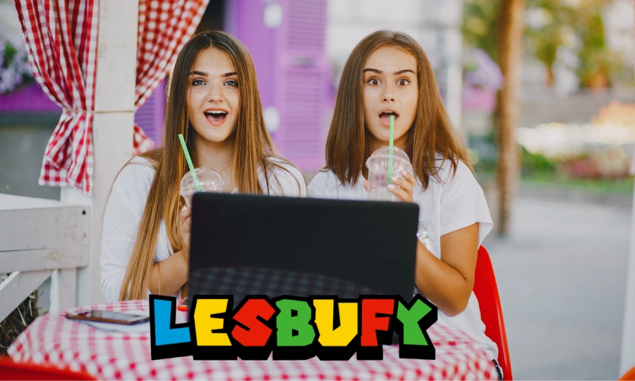 Two women exploring lesbufy platform on laptop - sapphic digital community and storytelling space for queer women