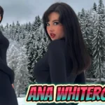 Ana Whiterose, Swiss pop singer, posing in snowy alpine landscape wearing black form-fitting outfit