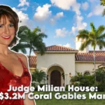Judge Marilyn Milian standing in front of the judge milian house — a Mediterranean-style mansion in Coral Gables, Florida