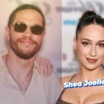 Shea Joelle James posing at a red carpet event beside Pete Davidson, wearing a sleek evening dress and elegant bun hairstyle.