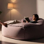 Person relaxing on a koshio bean bag in a modern living room with cozy decor.