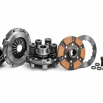 Sintterikytkin sintered clutch assembly diagram showing friction plate, pressure plate, hub, springs, and housing components in technical detail