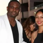 Juliette Vann with Darius McCrary at an event, smiling in evening attire