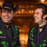 Chris and Taylor Malpass smiling in matching black and green embroidered western jackets — Malpass Brothers net worth and career overview 2026