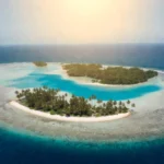 Aerial view of Lucipara Islands atoll surrounded by turquoise water and coral reefs in Indonesia's Banda Sea