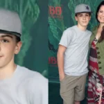 Riley Edward Donoho wearing a grey cap posing with his mother Holly Marie Combs at a movie premiere event