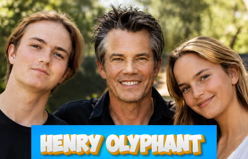 Timothy Olyphant posing outdoors with two young family members in a sunny setting with Henry Olyphant title text