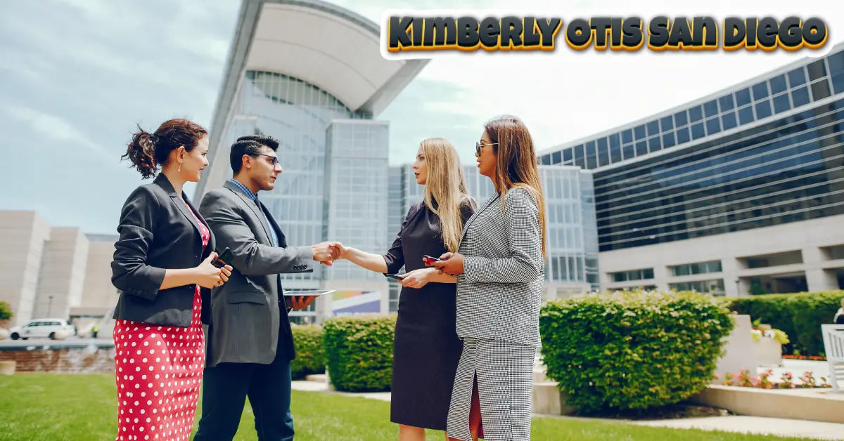 "Business professionals networking and shaking hands representing Kimberly Otis San Diego's collaborative leadership approach
