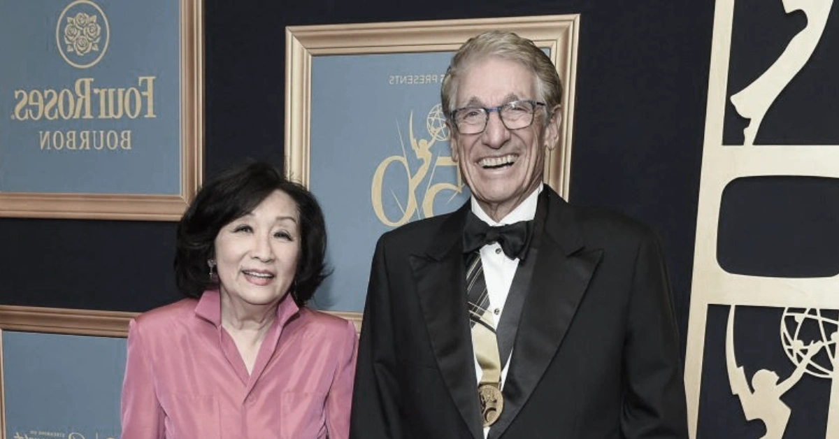 Phyllis Minkoff and Maury Povich at formal event, both smiling in elegant attire at award ceremony