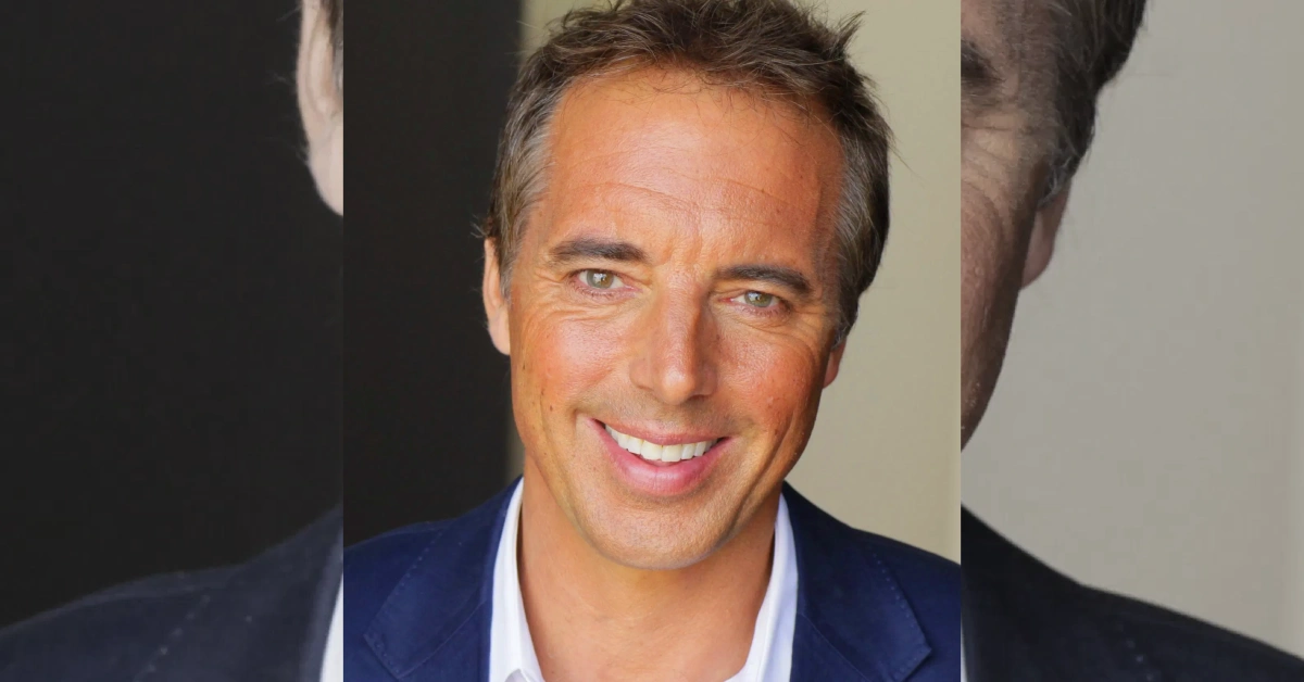 Dan Buettner smiling in navy blazer - longevity expert with $3 million net worth
