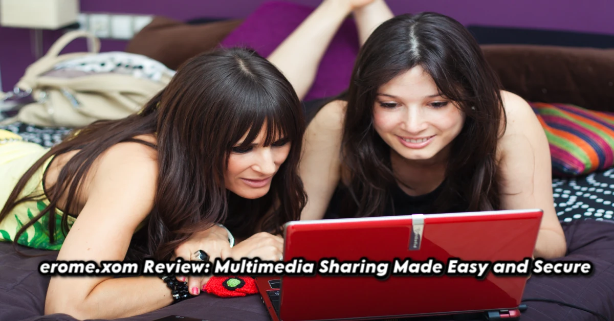 Two women happily watching content on a red laptop, representing easy and secure multimedia sharing on erome.xom