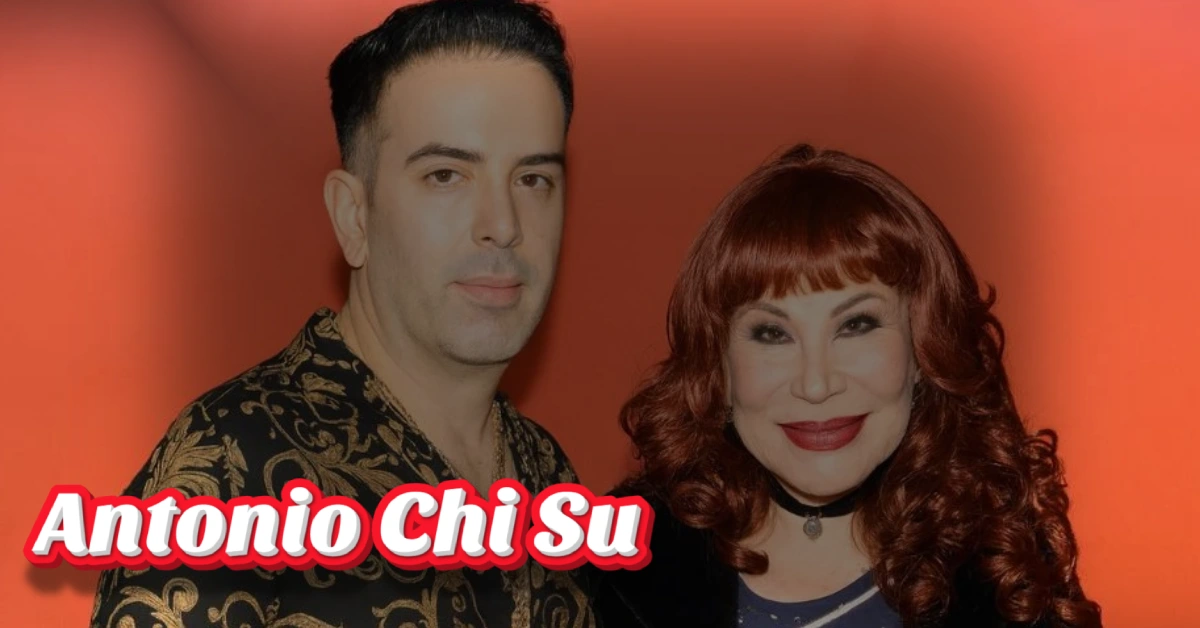 Antonio Chi Su and Lyn May posing together in stylish outfits against red background