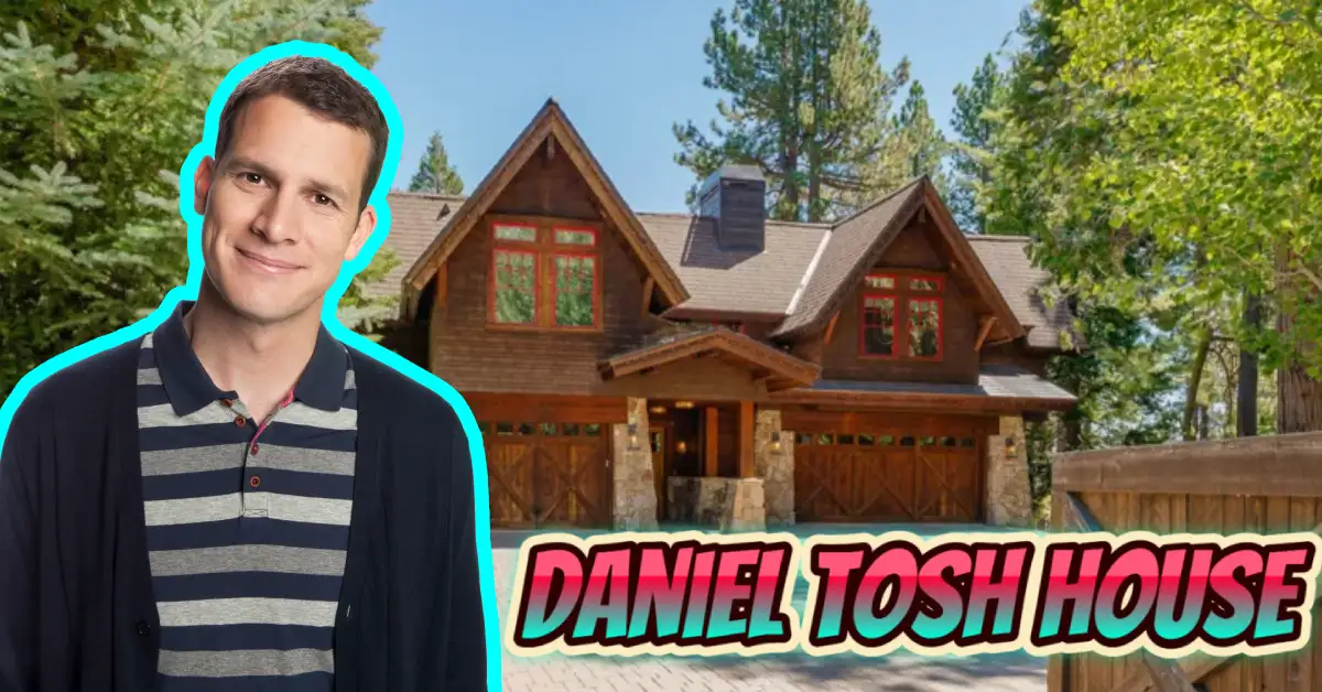Daniel Tosh house featuring the comedian standing in front of his luxury mountain-style home with wooden architecture and stone accents