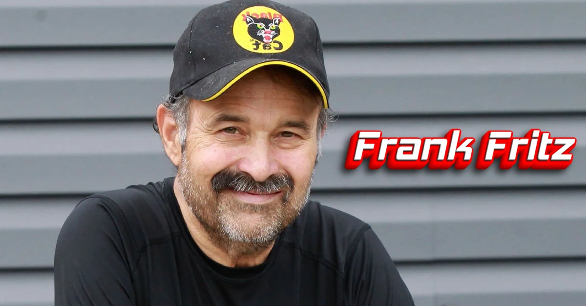 Frank Fritz smiling in a black baseball cap and black shirt, former co-host of History Channel's American Pickers reality show