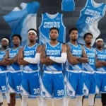 Custom basketball jersey team in blue and white uniforms with numbers and logos on indoor court